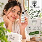 A woman in a white robe holds a bottle of Wild Organic Glycerine against a warm bathroom background, with promotional text reading 'Coming Soon' and 'Stay Tuned!'.